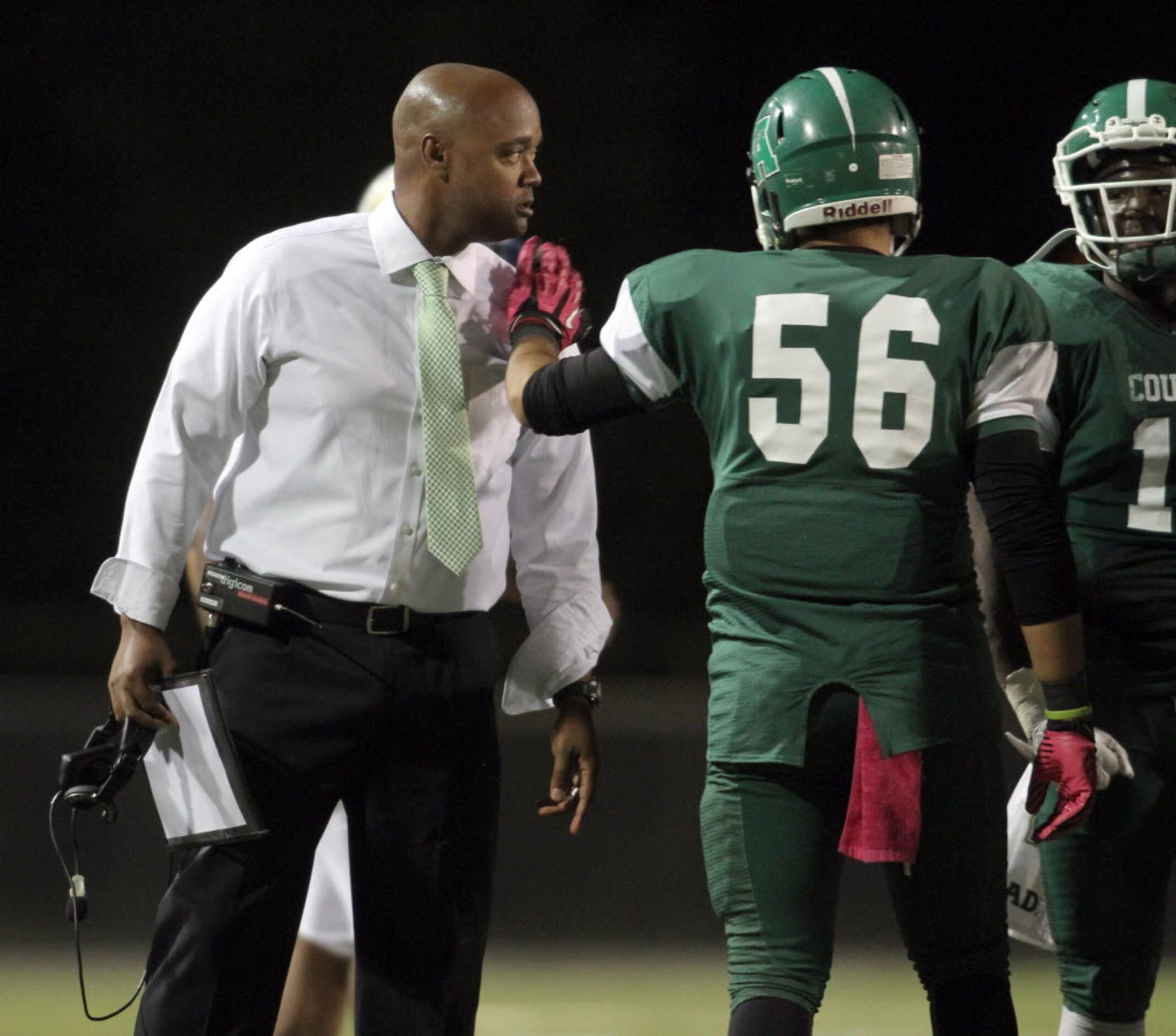 Bryan Adams head coach Hank Willis Jr. speaks with his players during a timeout in the...