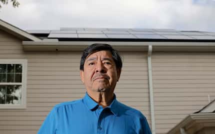 Jesus Hernandez stands in front of his house in Irving. He took Southern Solar of...