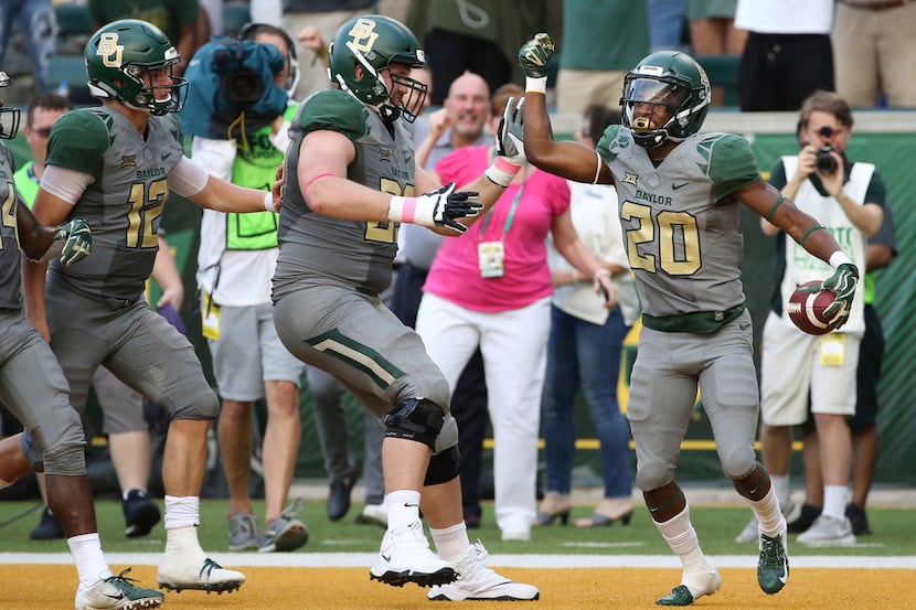 Baylor running back Craig Williams (20) celebrates his touchdown against Kansas State in the...