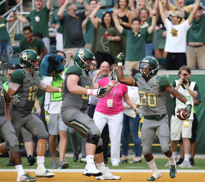 Baylor running back Craig Williams (20) celebrates his touchdown against Kansas State in the...