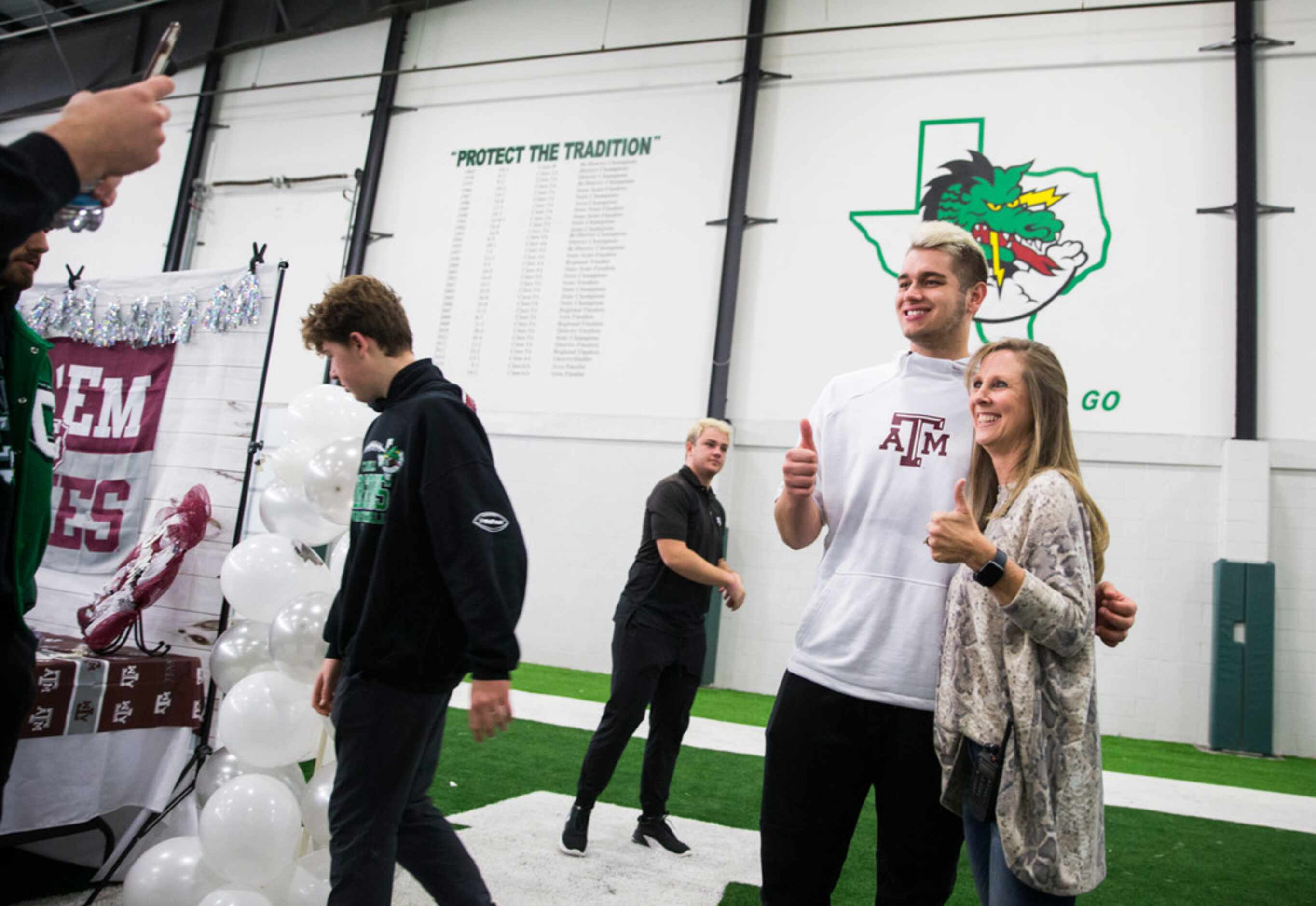 Southlake Carroll football player Blake Smith poses for  photos after signing a national...