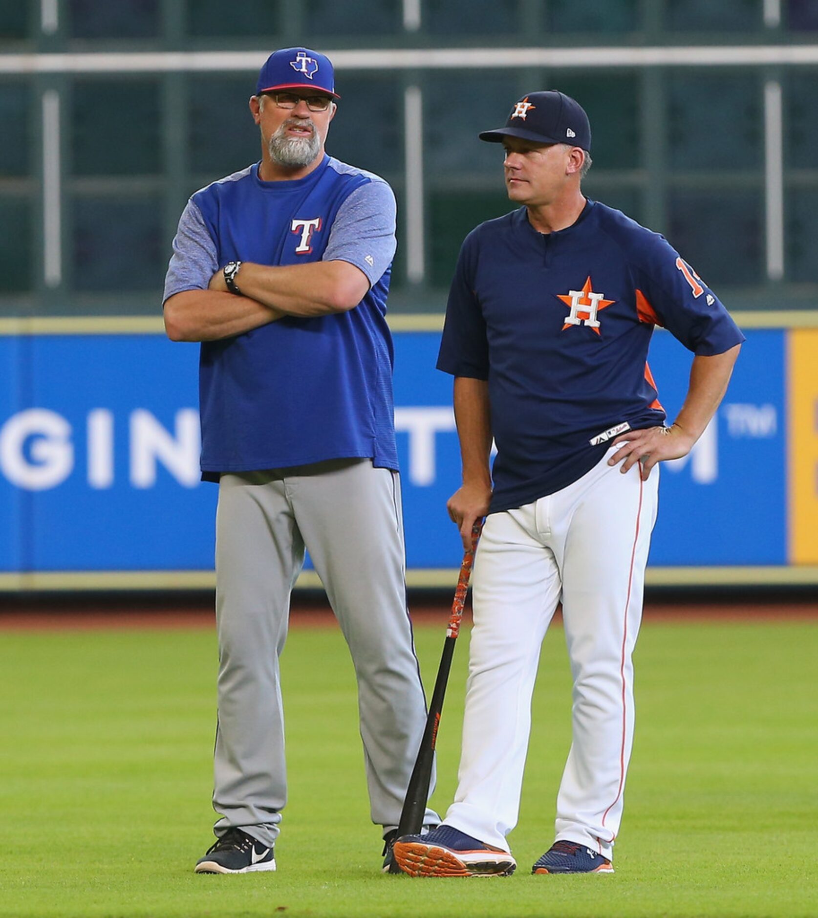 HOUSTON, TX - MAY 11:  Manager AJ Hinch #14 of the Houston Astros, right, and pitching coach...