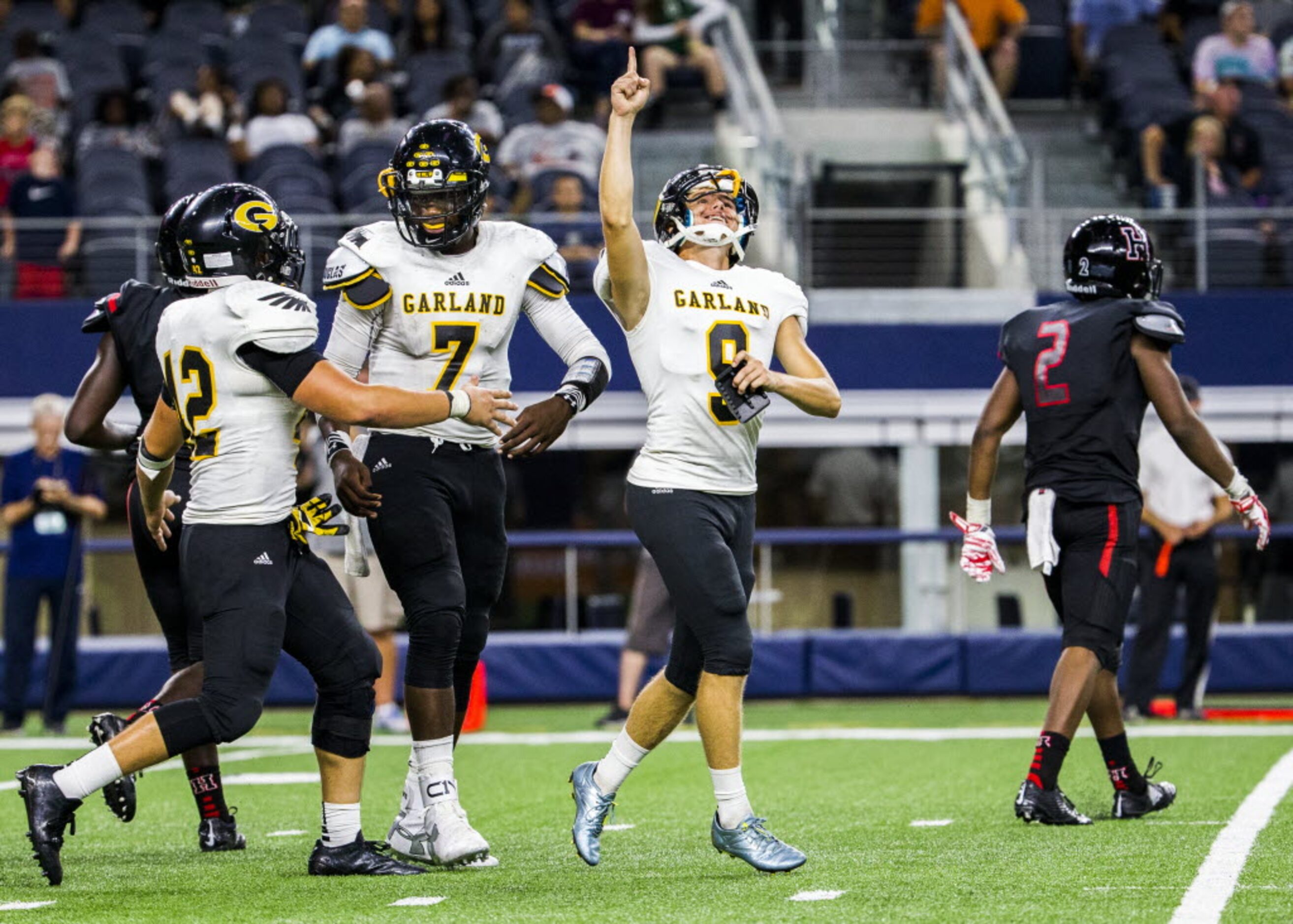 Garland kicker Jackson Hunter Merriman (9) celebrates a successful extra point kick after...