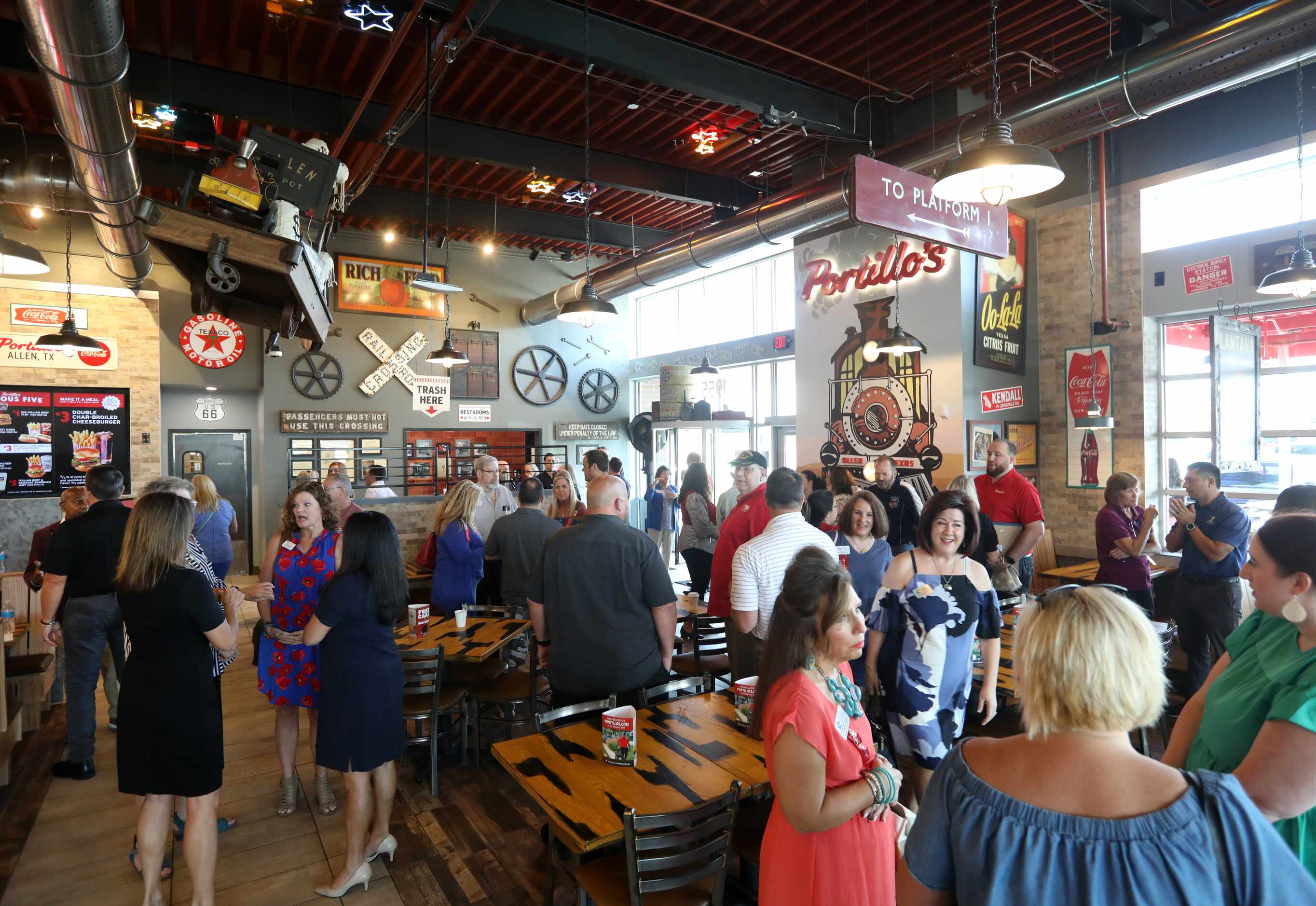 Guests mingle as they wait for the grand opening at Portillo's in Allen.
