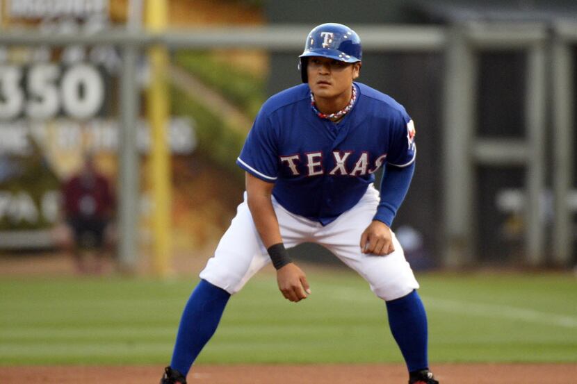 Mar 13, 2014; Surprise, AZ, USA; Texas Rangers designated hitter Shin-Soo Choo (17) leads...