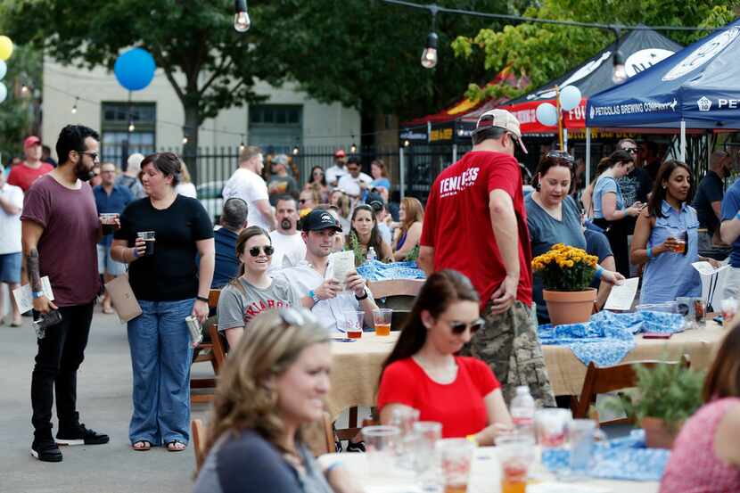 TexToberfest goers at Eno's Pizza Tavern in the Bishop Arts District, Sunday, September 24,...
