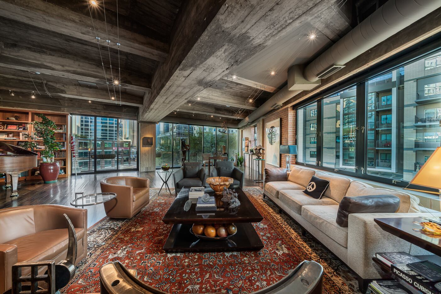 This Dallas luxury loft has a two-story foyer and views of the city