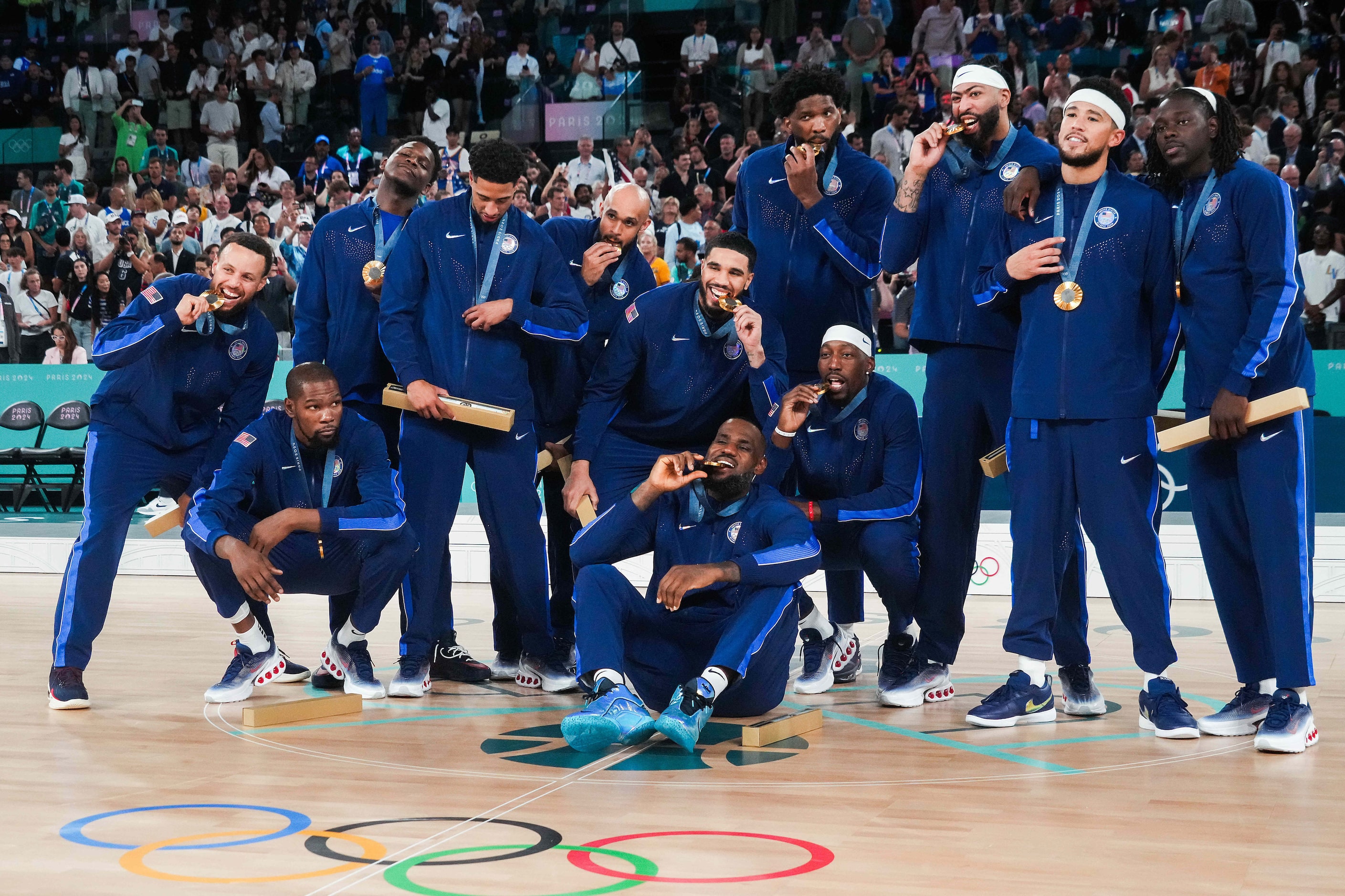 Team USA poses for a team photo after a victory over France in the men's gold medal...