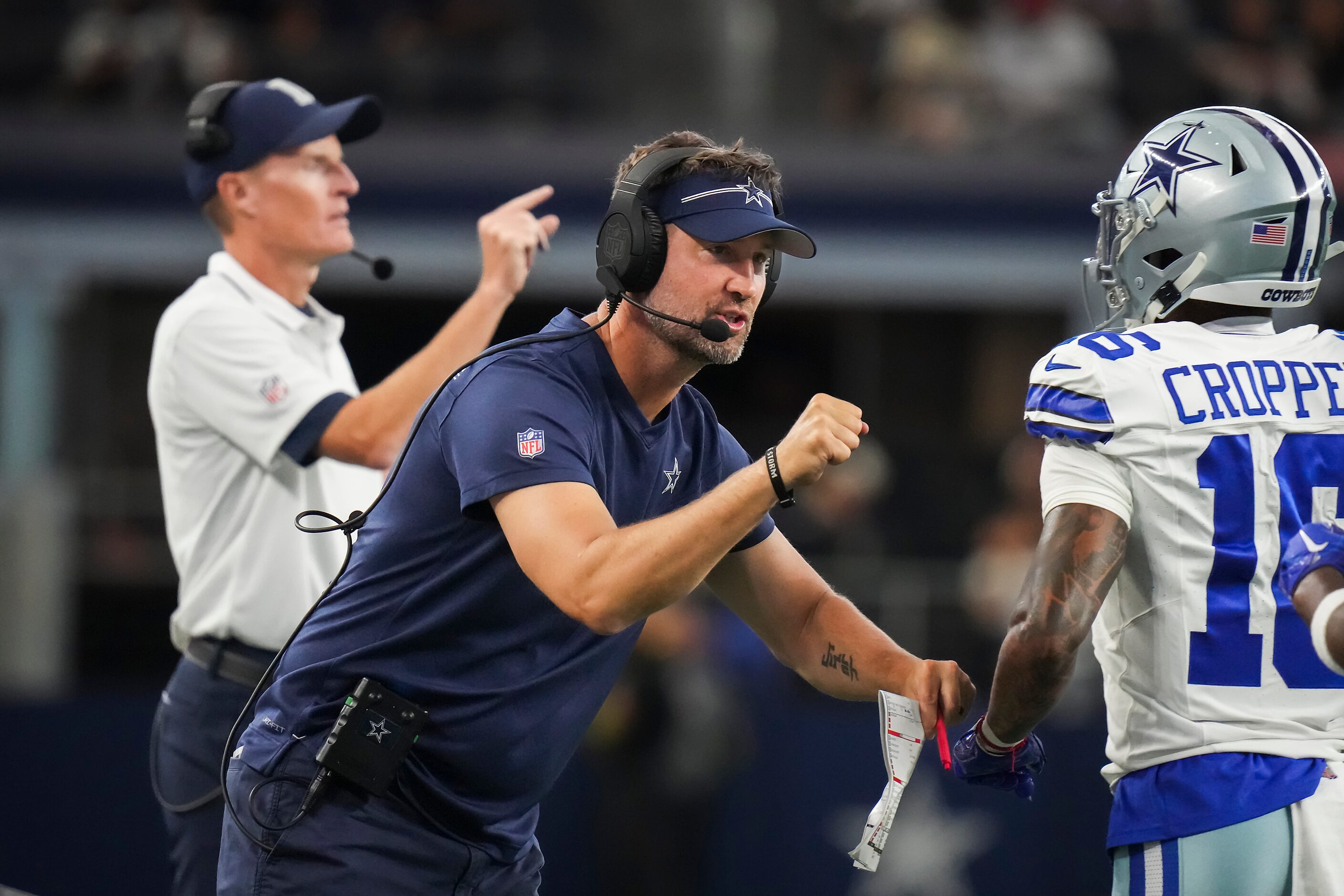 Dallas Cowboys offensive coordinator Brian Shottenheimer celebrates with wide receiver Jalen...