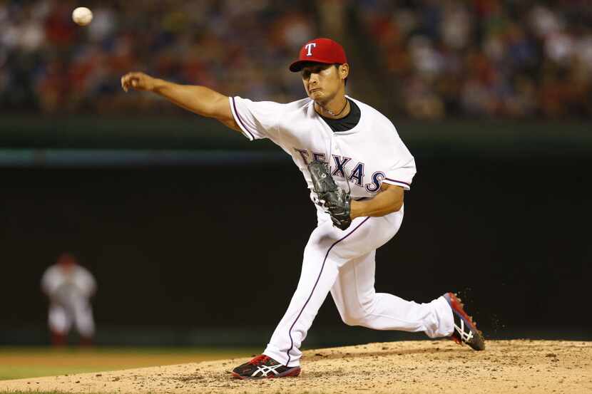 Apr 11, 2014; Arlington, TX, USA; Texas Rangers starting pitcher Yu Darvish (11) throws in...