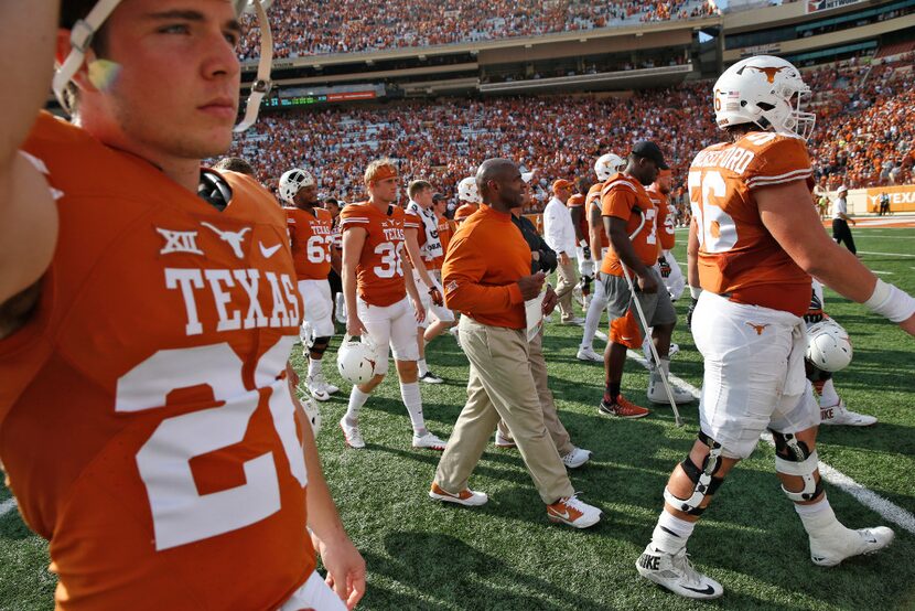 Texas Longhorns head coach Charlie Strong walks on the field after being defeated by West...