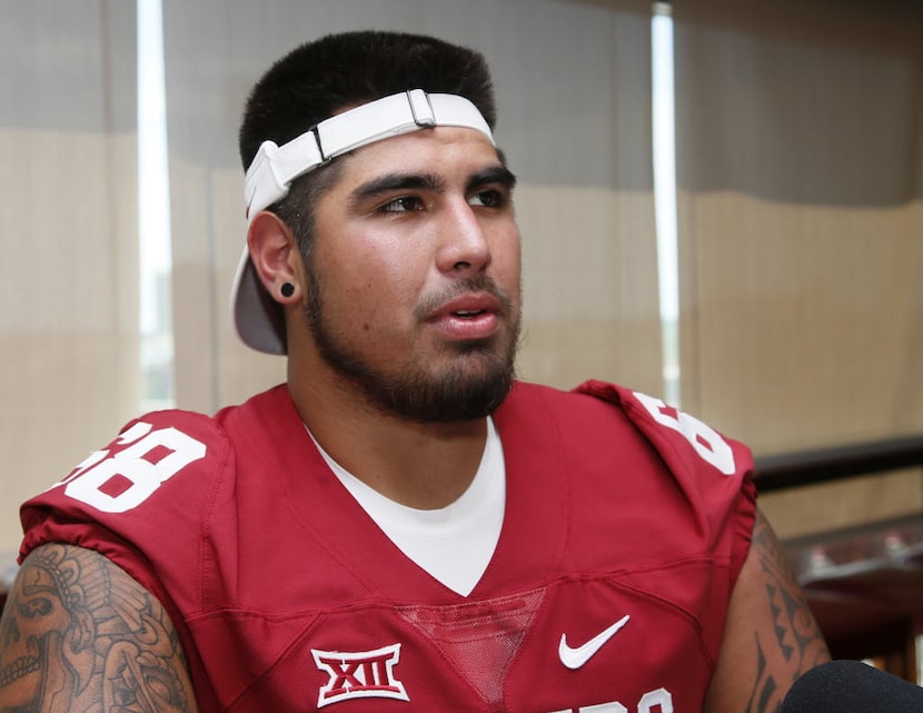 In this Saturday, Aug. 6, 2016, photo, Oklahoma center Jonathan Alvarez talks during an NCAA...