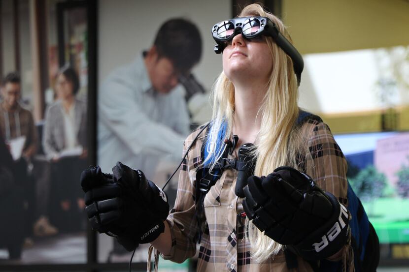 Sophomore Lauren Caves tested augmented reality goggles made by students at the University...