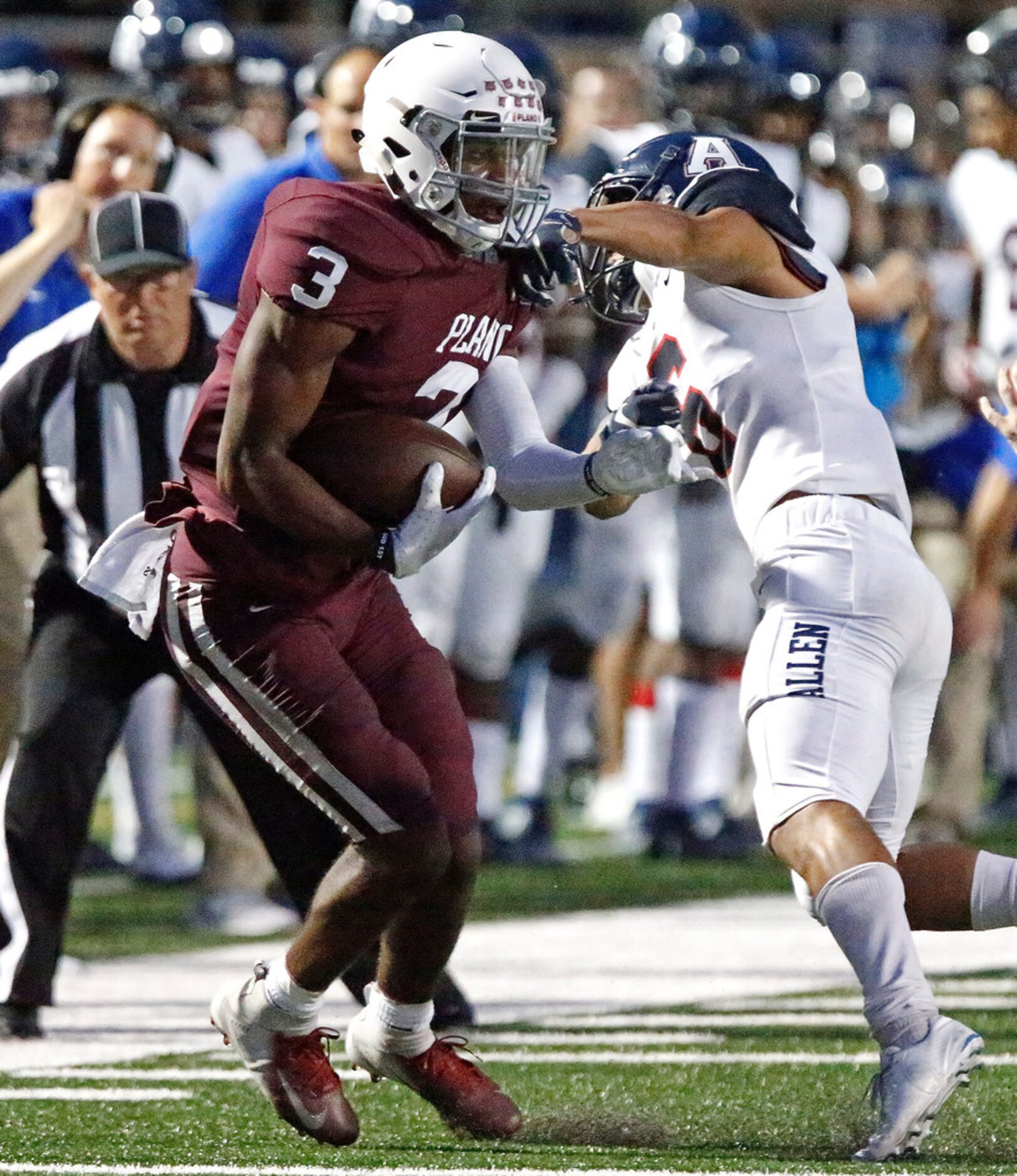 Allen High School defensive back Matthew Norman (6) tries to stop Plano High School wide...