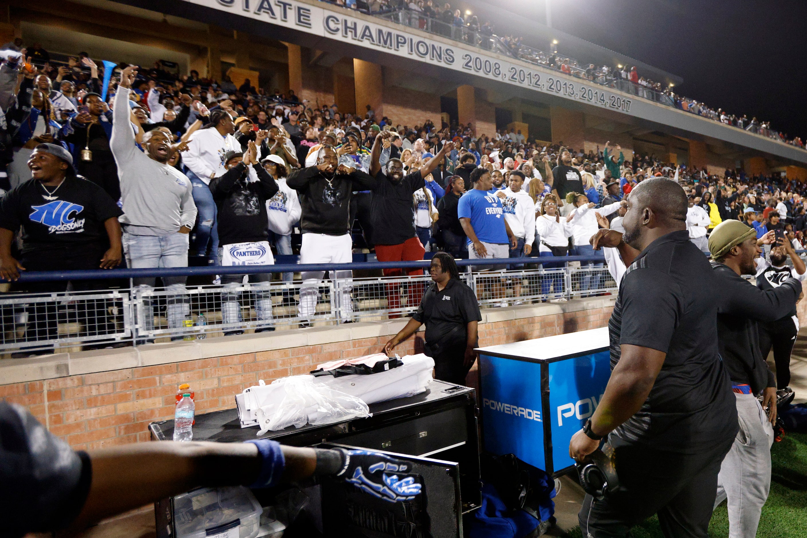 North Crowley head coach Ray Gates celebrates with fans in the closing seconds of the fourth...