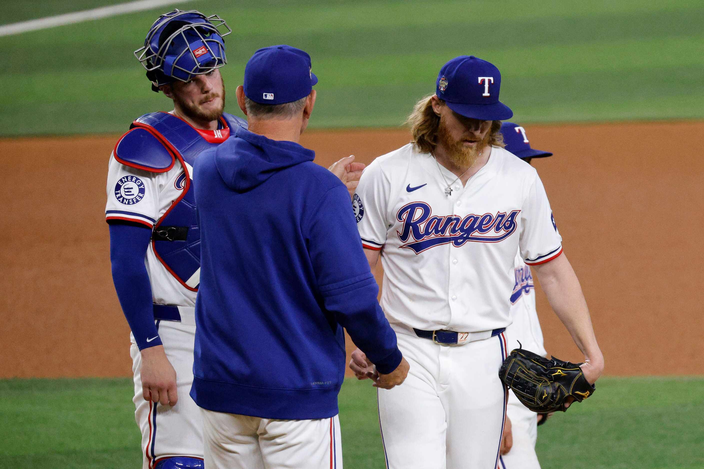 Texas Rangers pitcher Jon Gray (22), right, turns the ball over to Texas Rangers manager...