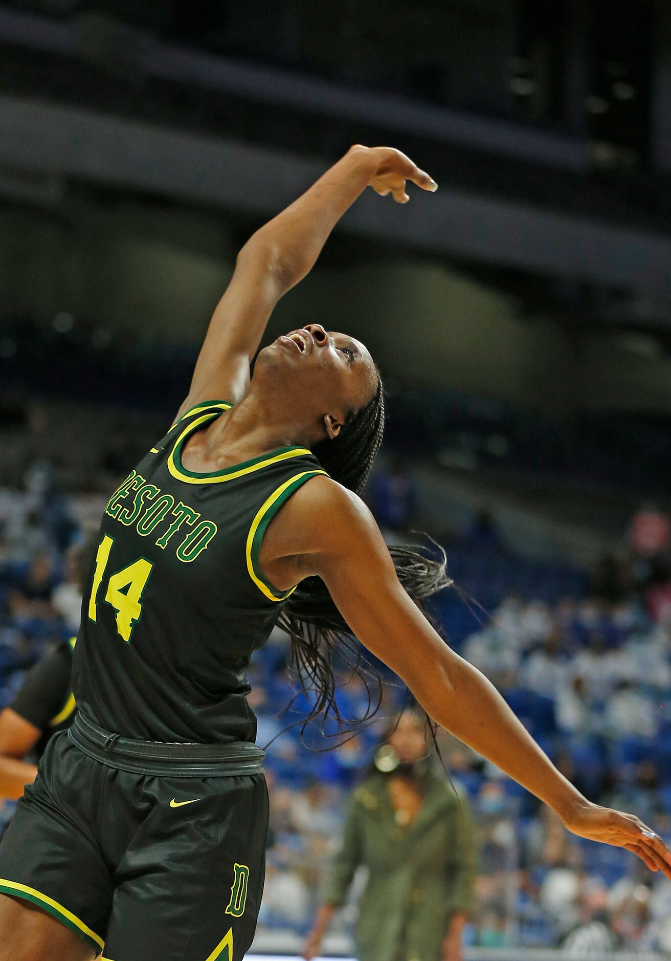 DeSoto Amina Muhammad #14 follows her shot. DeSoto vs. Cypress Creek girls basketball Class...