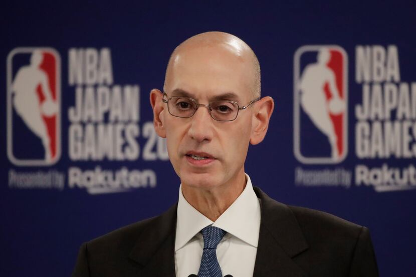 FILE - In this Oct. 8, 2019 file photo, NBA Commissioner Adam Silver speaks at a news...