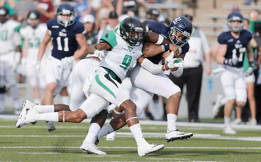 HOUSTON, TX - SEPTEMBER 24: Wide receiver Parker Smith #11 of the Rice Owls is chased by...