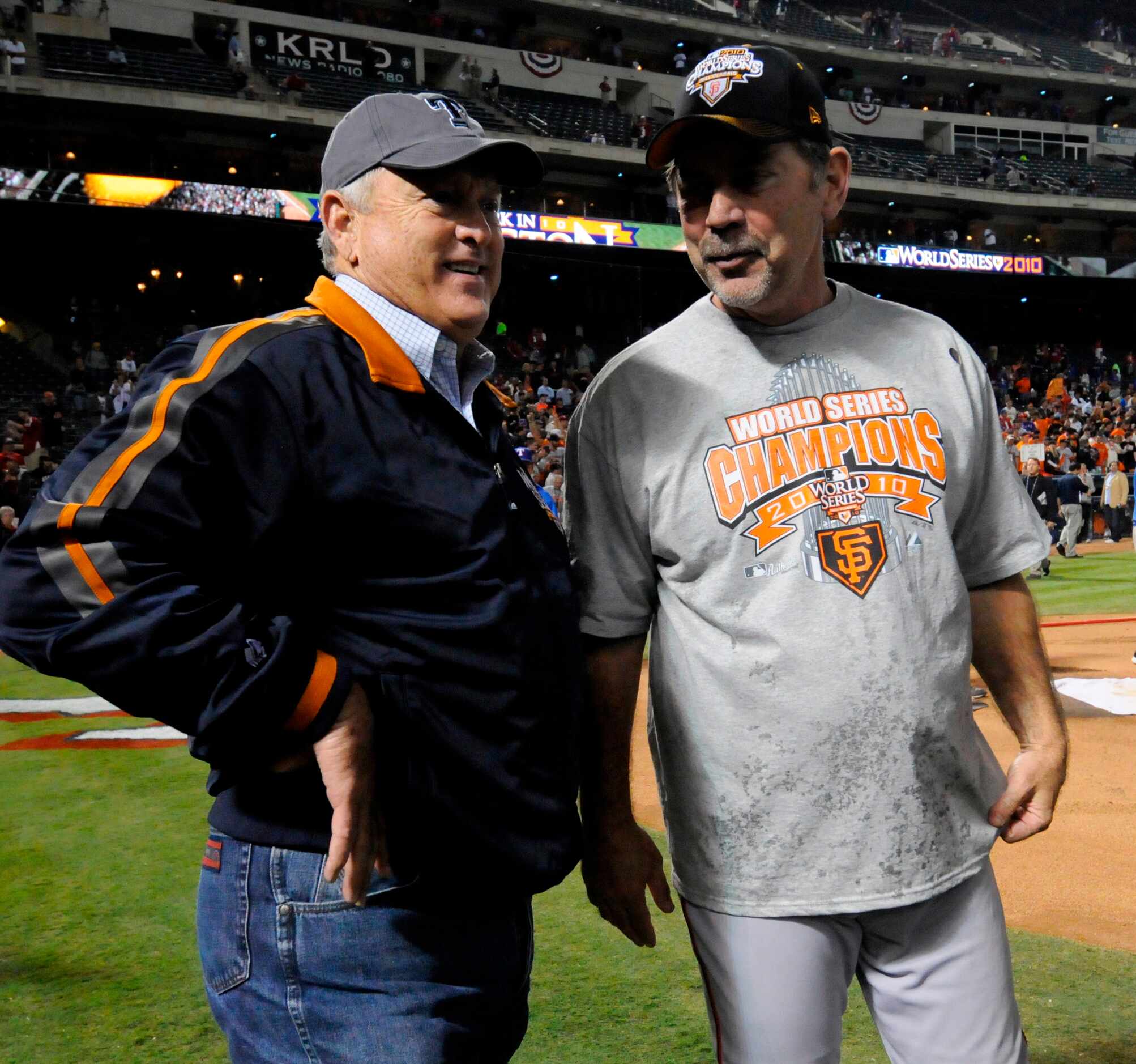 Rangers president Nolan Ryan (left) visits with Giants manager Bruce Bochy after the San...