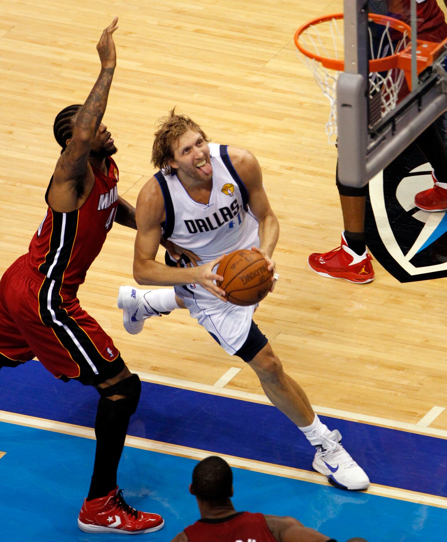 Miami, FLORIDA, USA. 12th June, 2011. Dallas Mavericks' Dirk Nowitzki (L)  celebrates with teammate Tyson Chandler near the end of Game 6 of the NBA  Finals basketball series against the Miami Heat