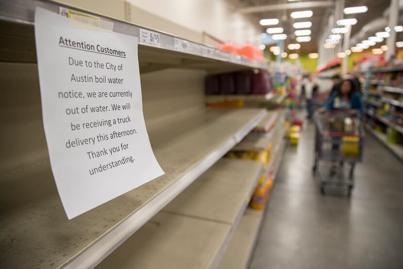 Empty shelves where water was sold at an H-E-B in Austin on Monday.