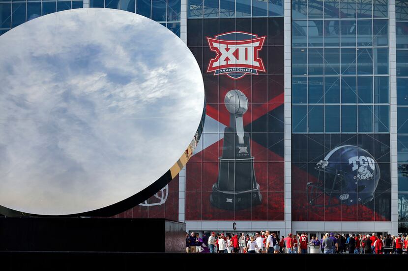 The Big XII Championship logo appears behind the Sky Mirror sculpture outside AT&T Stadium...