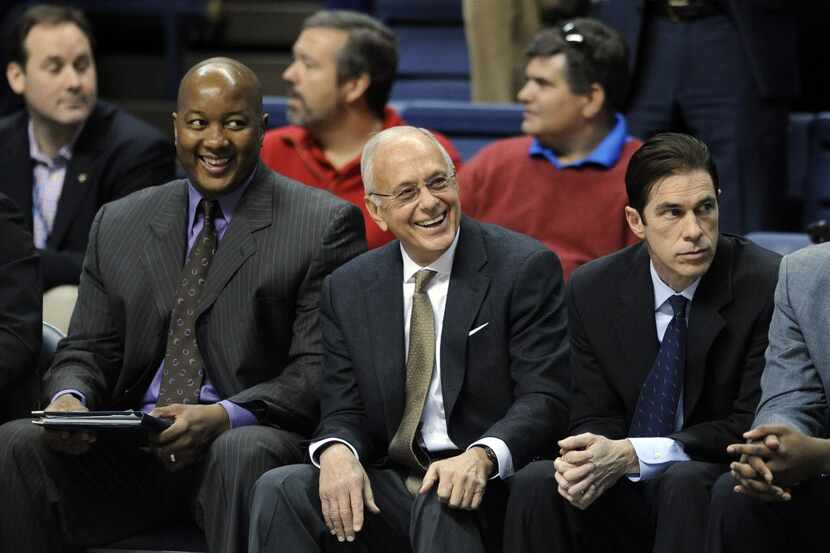 SMU head coach Larry Brown, center, enjoys a moment before his team's 64-55 victory over...
