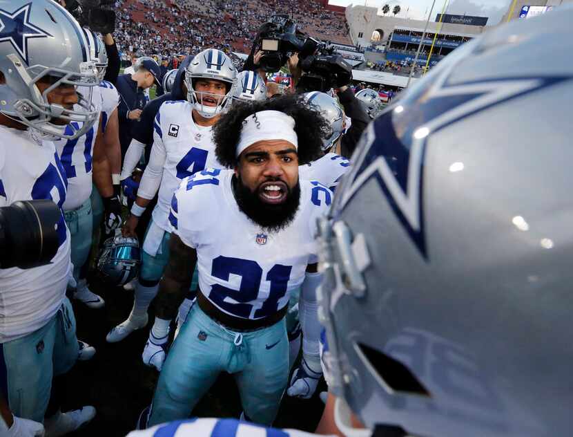 Dallas Cowboys players get fired up by running back Ezekiel Elliott (21) before their NFC...