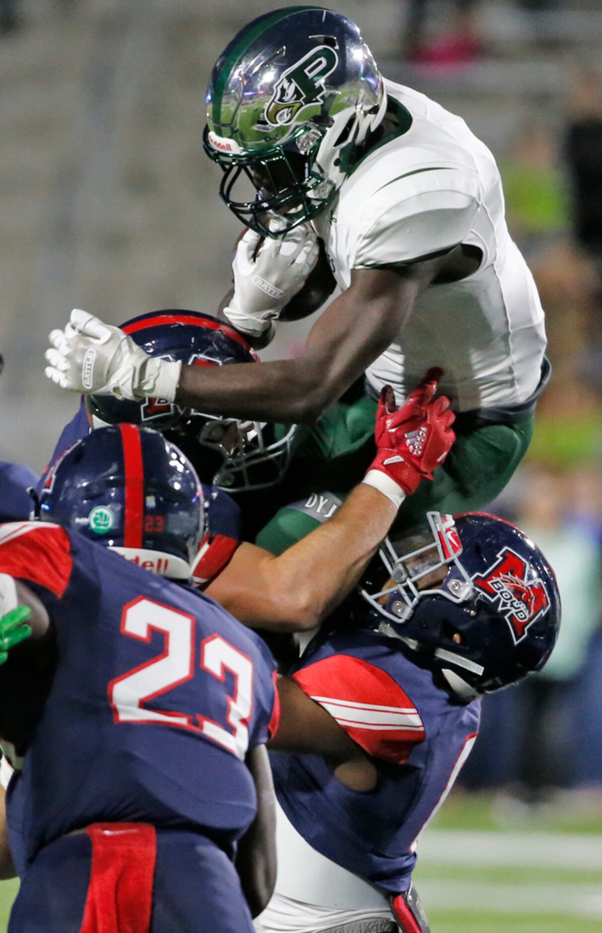 THe McKinney Boyd defense stops Prosper running back Wayne Anderson (7) on a first-quarter...