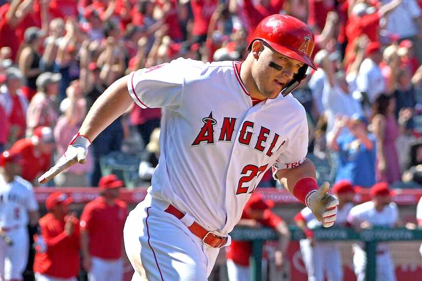ANAHEIM, CA - APRIL 06: Mike Trout #27 of the Los Angeles Angels of Anaheim rounds the bases...
