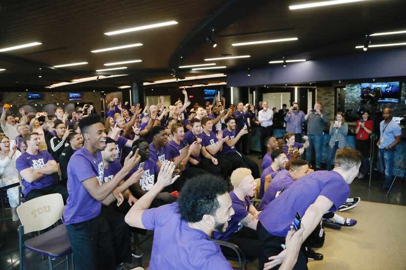 The TCU Men's basketball team and fans react after they are selected to the NCAA basketball...