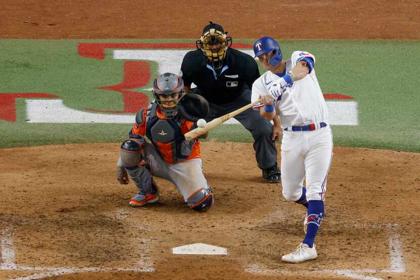 Texas Rangers third baseman Josh Jung (6) hits a two-run home run during the seventh inning...