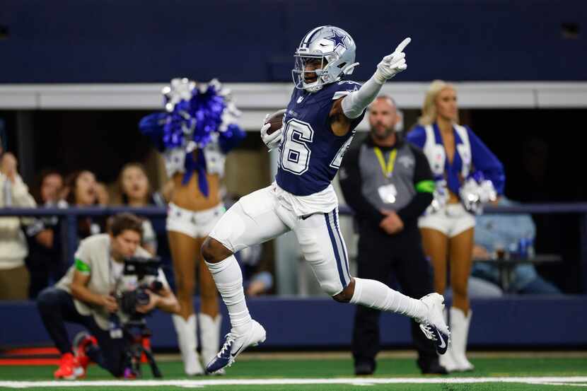 Dallas Cowboys cornerback DaRon Bland (26) celebrates as he returns an interception for a...