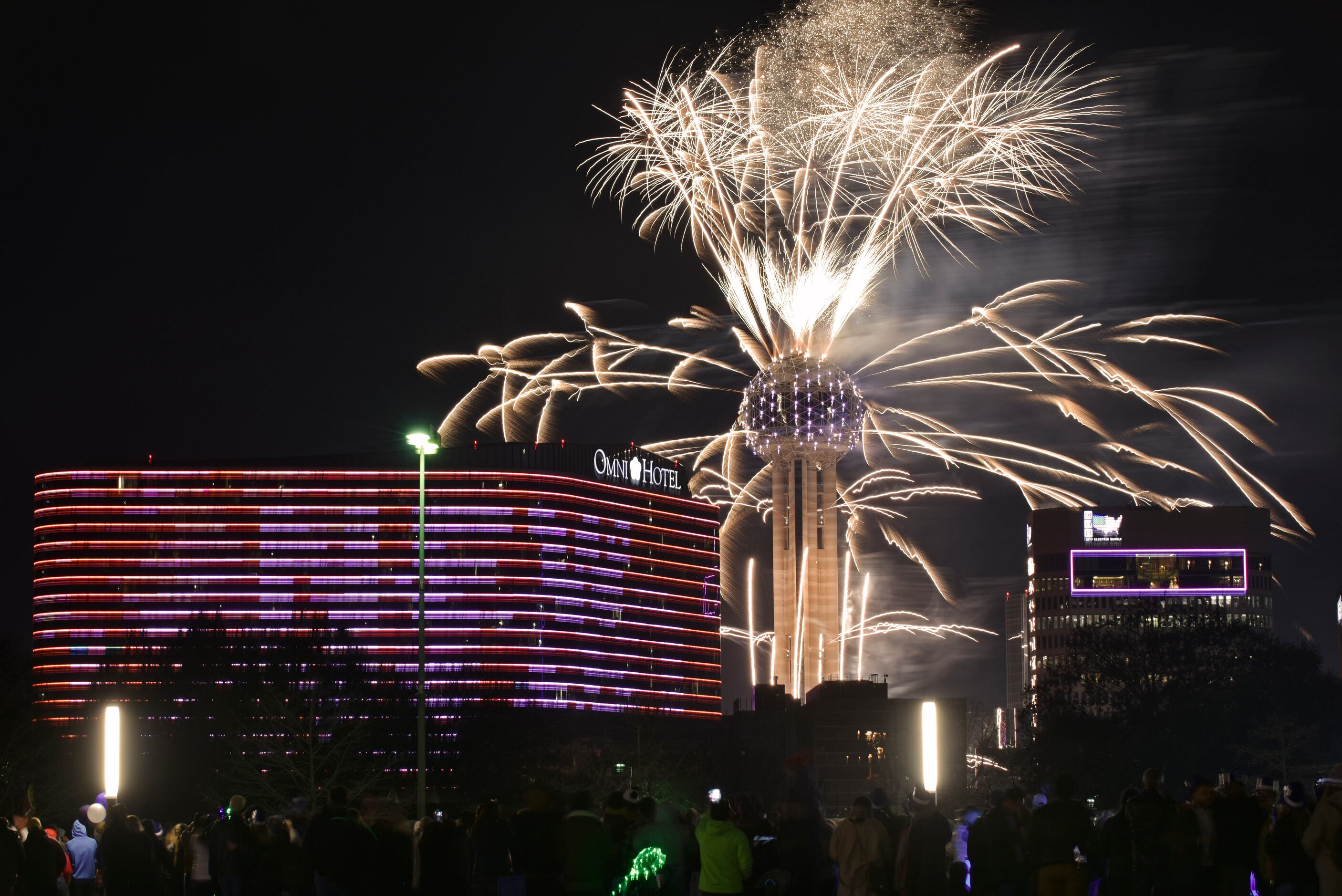 Fireworks from Reunion Tower ring in the new year during the New Year's Eve Party on the...