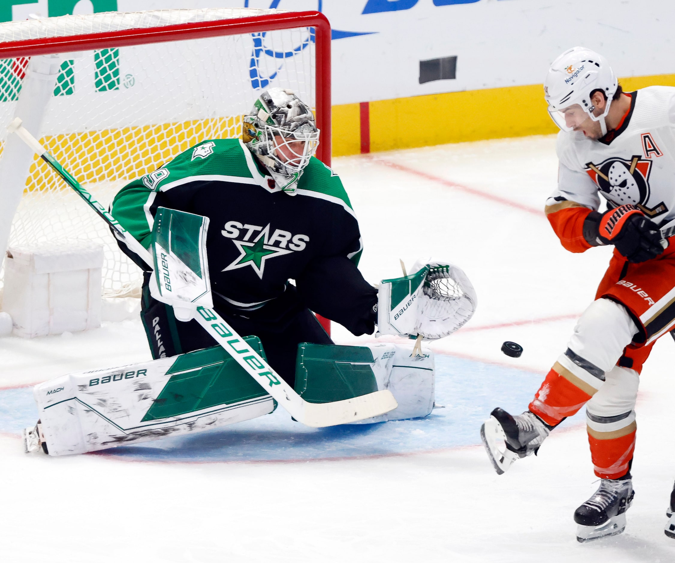 Dallas Stars goaltender Jake Oettinger (29) stops an Anaheim Ducks shot during the second...