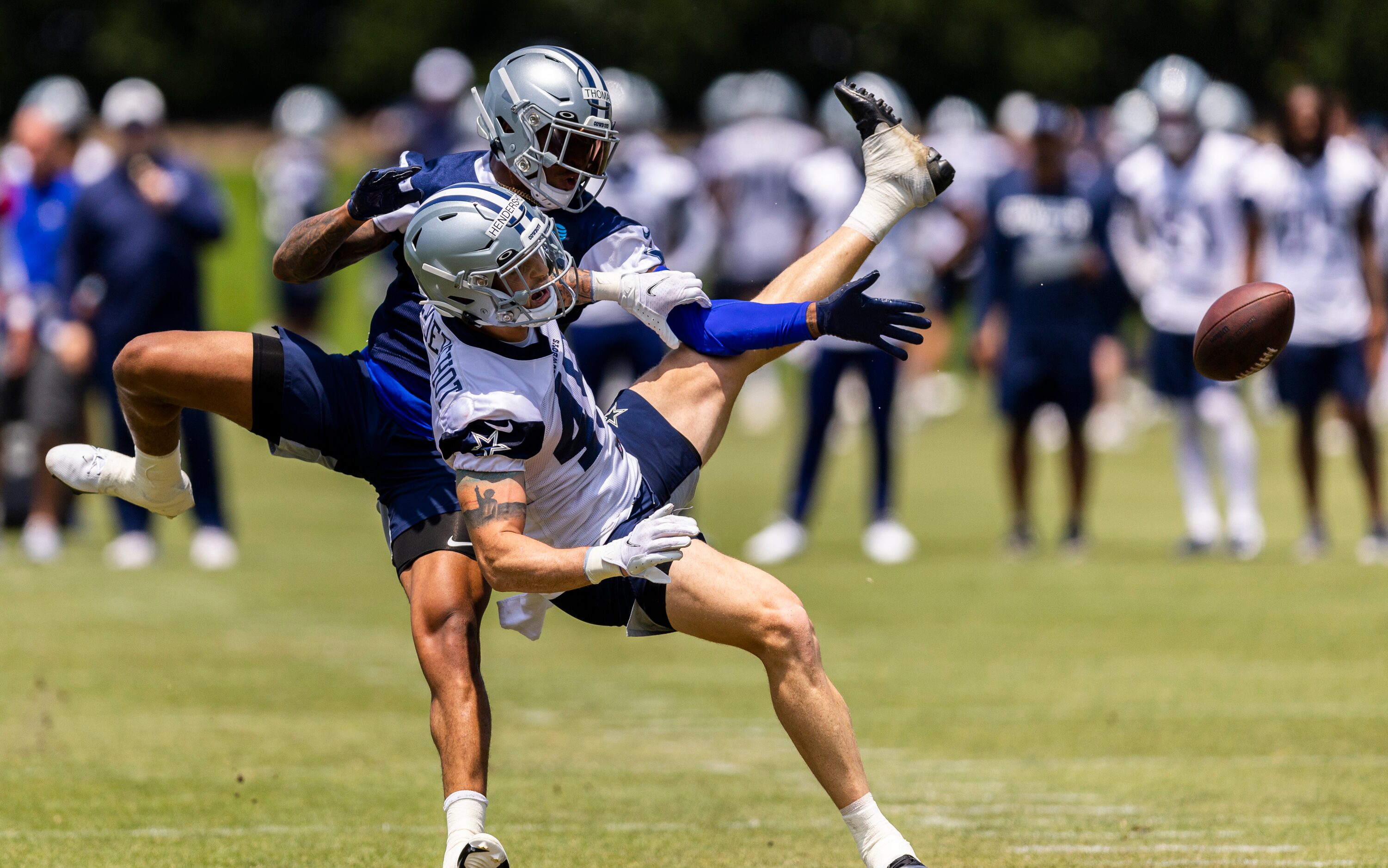 Dallas Cowboys safety Juanyeh Thomas, back, breaks up a pass intended for tight end Peyton...