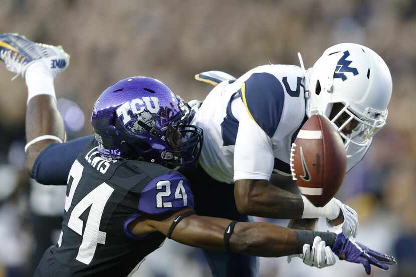 TCU Horned Frogs cornerback Julius Lewis (24) knocks the ball away from West Virginia...