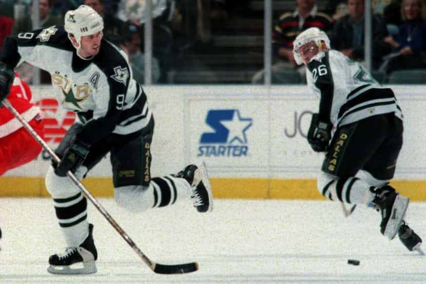 Mike Modano (9) and Jere  Lehtinen (26) head up the ice against Detroit at Reunion Arena in...