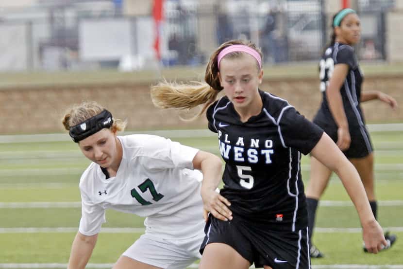 Plano West player Abby Grace Cooper (5) keeps the ball from San Antonio Reagan player Sarah...