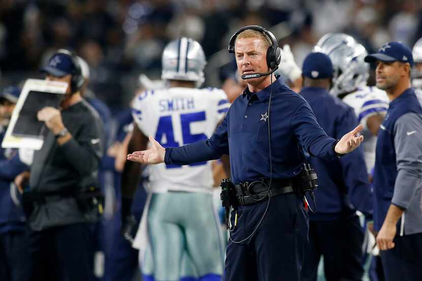 Dallas Cowboys head coach Jason Garrett questions a call in the first half of a game against...