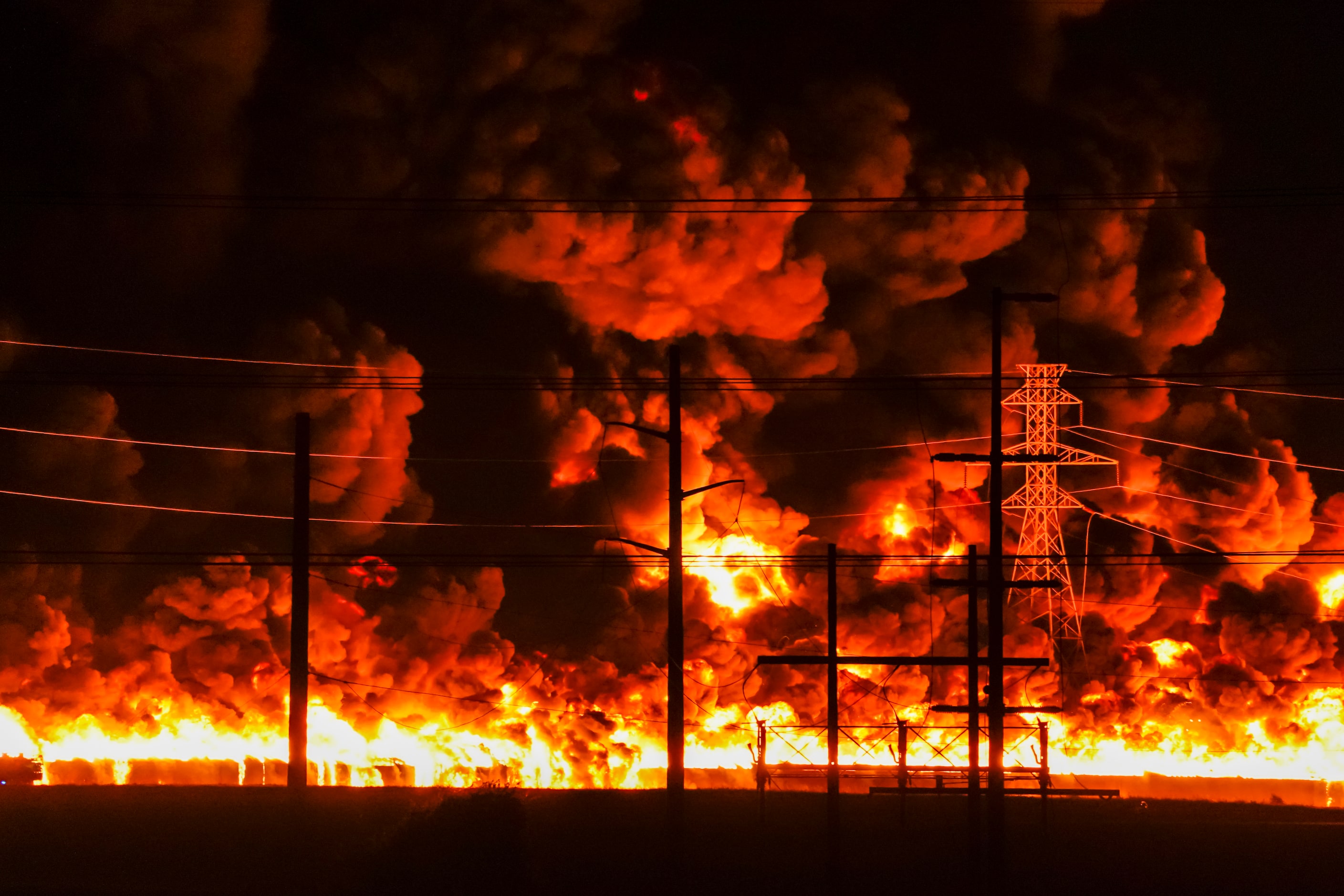 Flames erupt from a massive fire at  Poly-America on Wednesday, Aug. 19, 2020, in Grand...