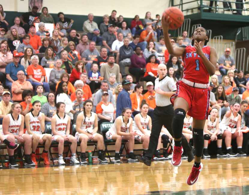 To the dismay of Rockwall fans and the team bench, Dallas Skyline's Jaylan Gulley (1) scores...