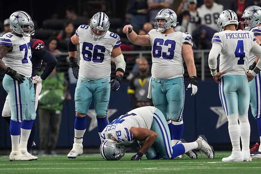 Dallas Cowboys offensive tackle Terence Steele (78) waits for medical attention after being...