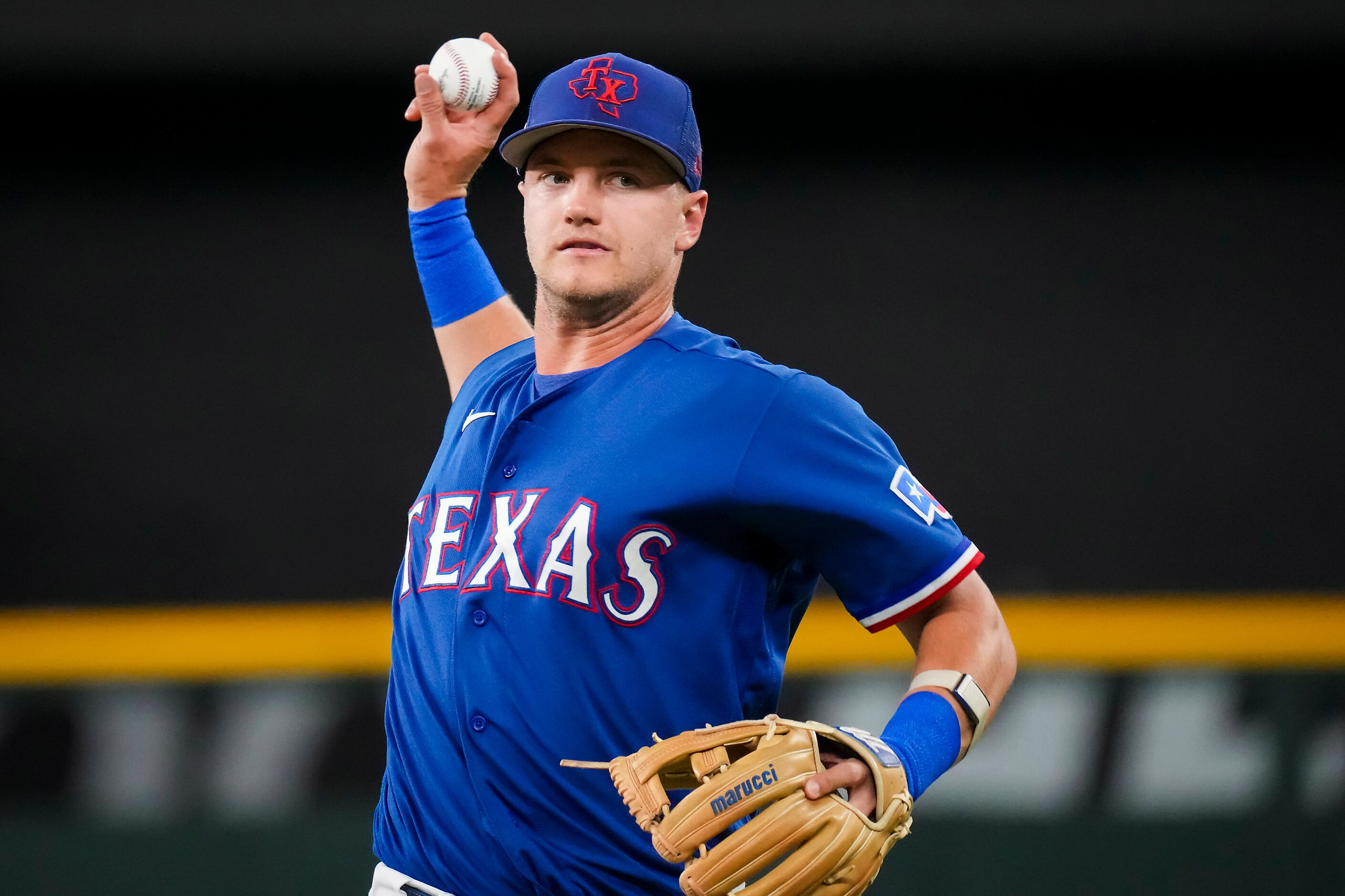 Texas Rangers third baseman Josh Jung warms up before an exhibition baseball game against...