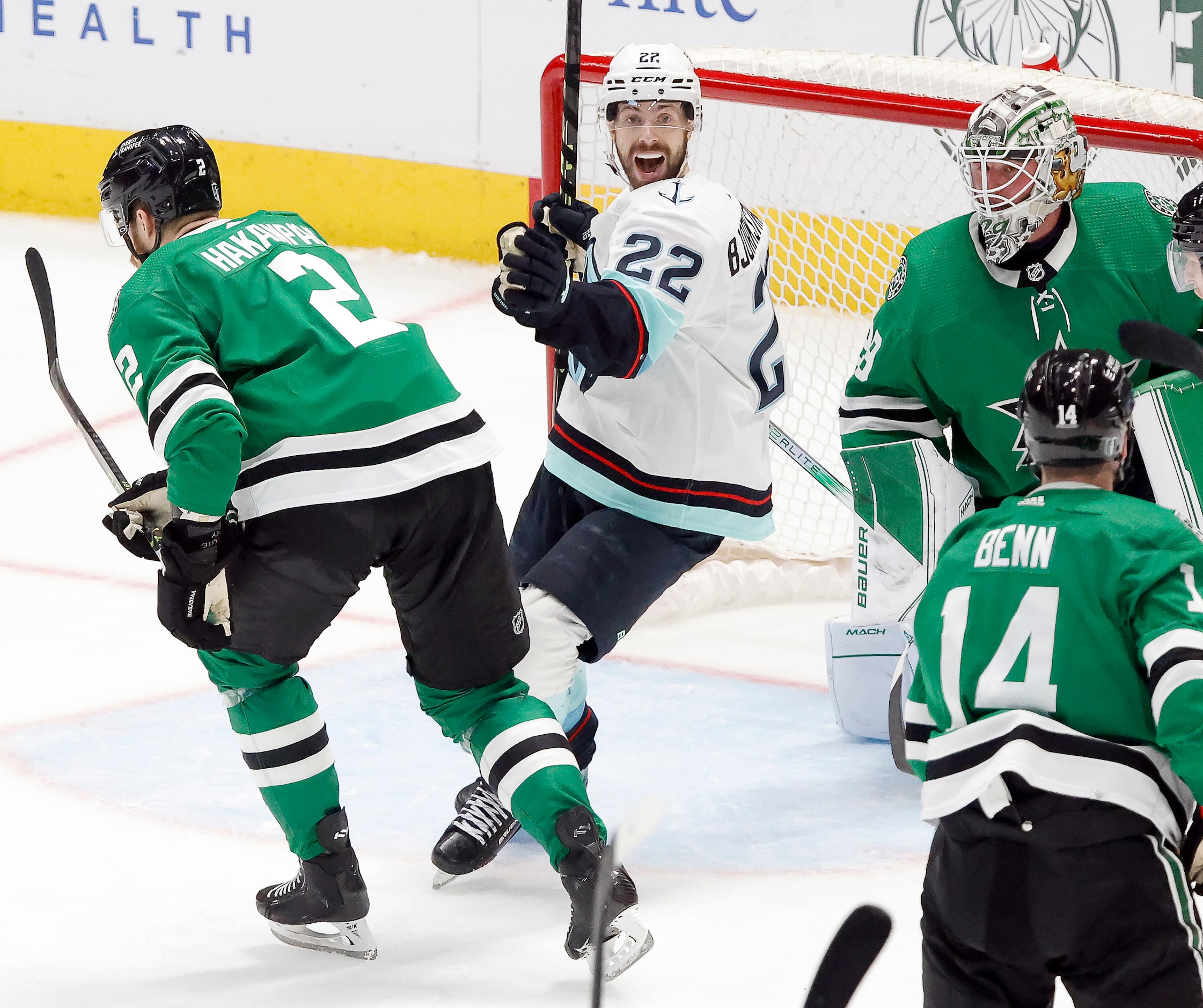 Seattle Kraken right wing Oliver Bjorkstrand (22) celebrates the winning goal against Dallas...