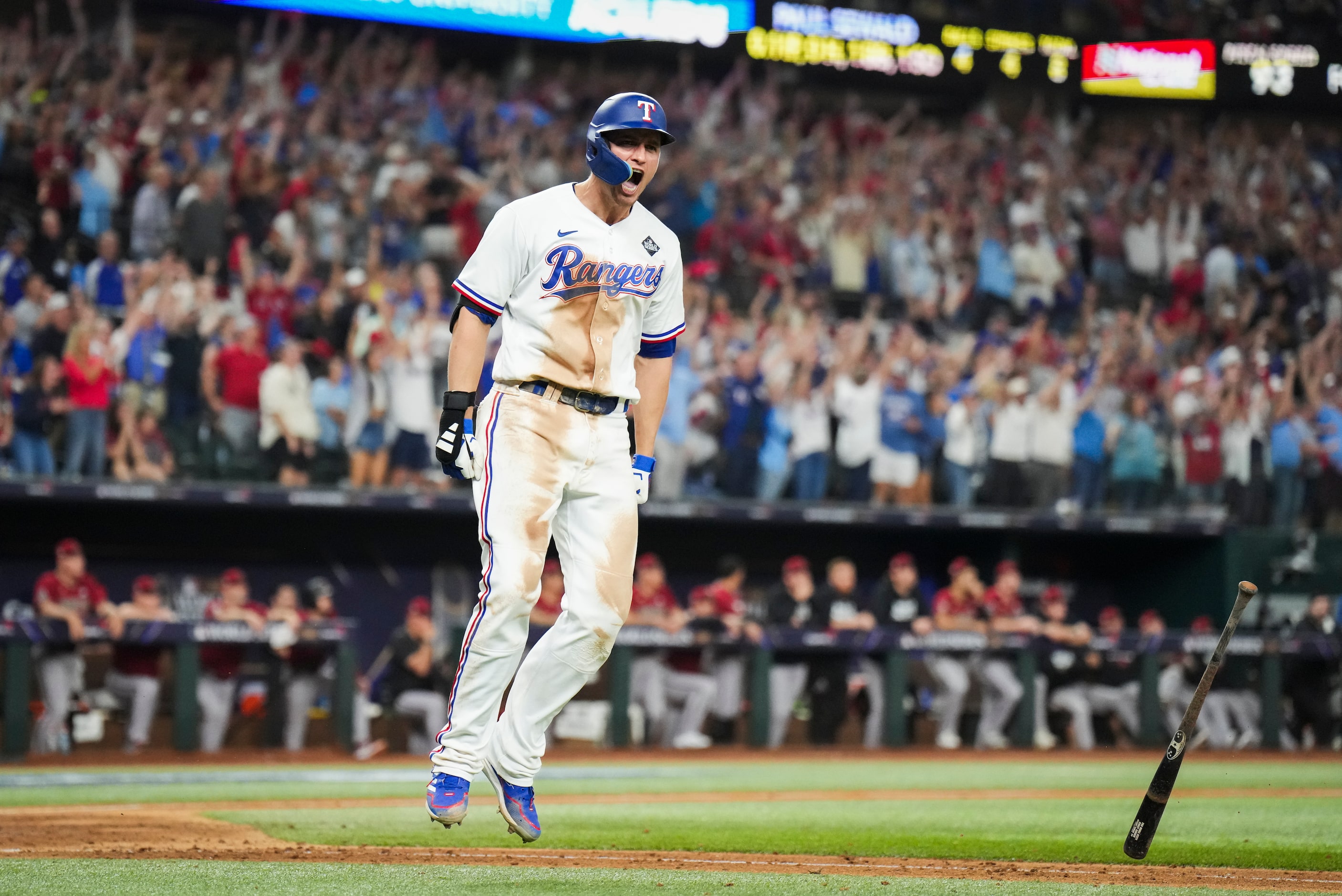 Texas Rangers' Corey Seager celebrates after hitting a two-run home run to tie the game...