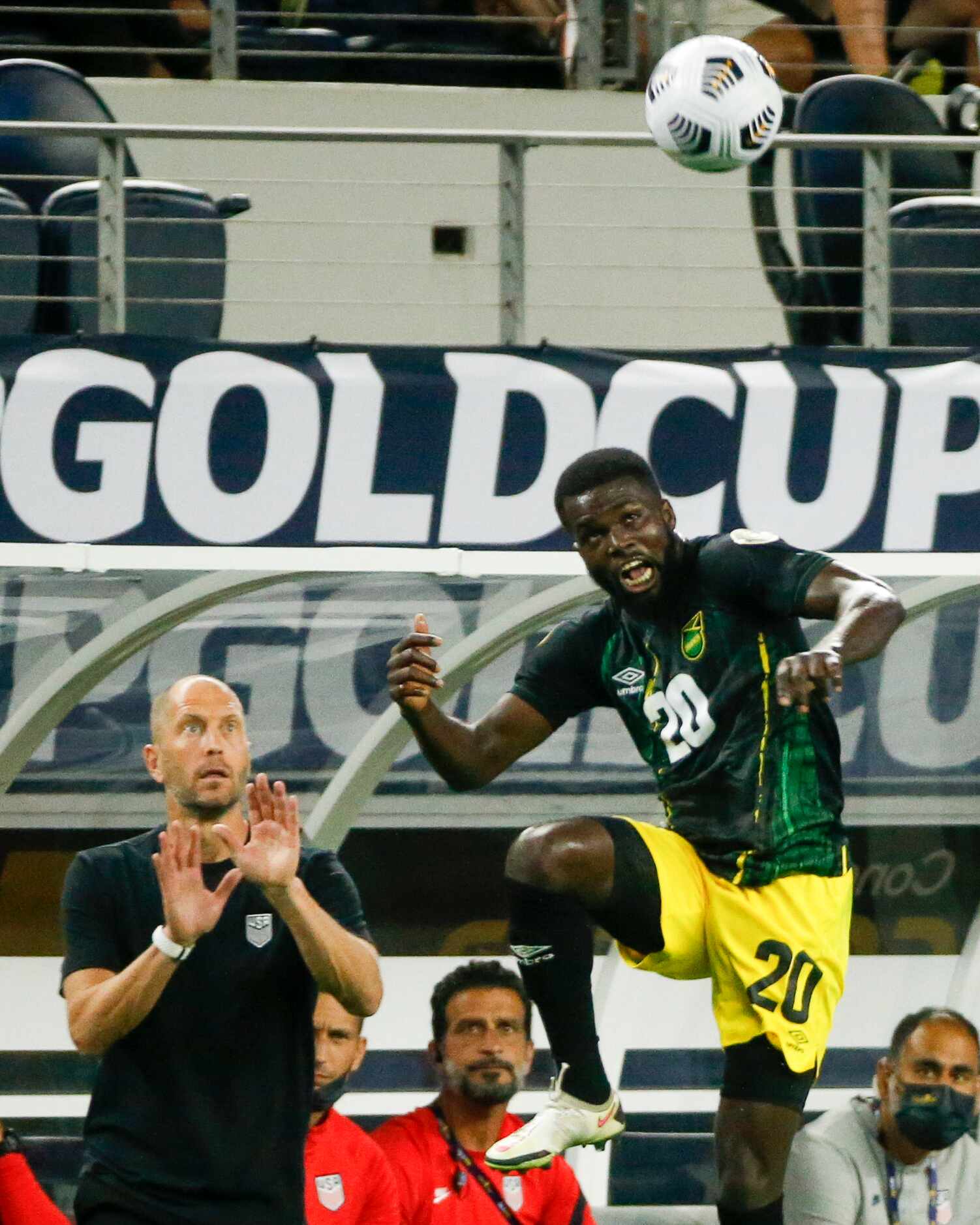 Jamaica defender Kemar Lawrence (20) leaps for the ball in front of USA head coach Gregg...