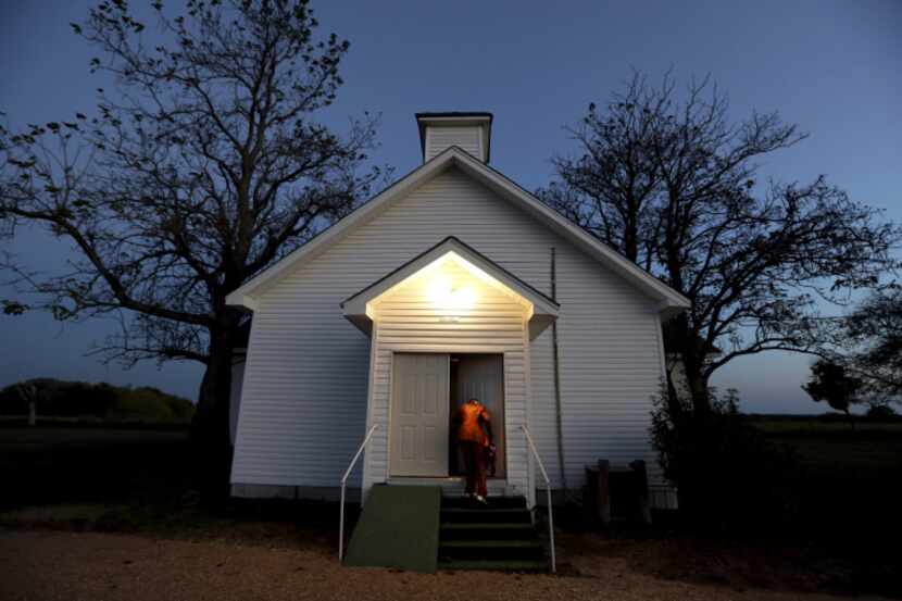 Darlene Holloway arrives for a church service in Pelham, one of the state’s dwindling number...