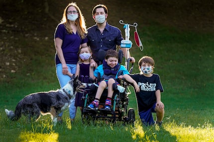 Catherine and Jeff Carlton, shown in their yard with their children (from left) Jenna,...